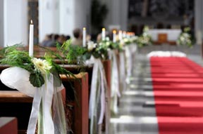 Wedding Flowers on Pews in Church